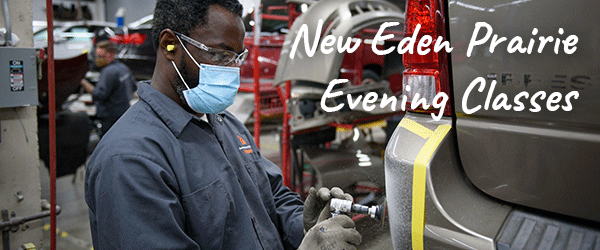 Man painting the rear bumper of a car