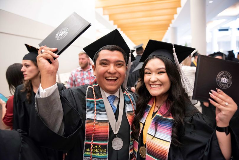 Graduates Josh Rios and his sister celebrate receiving awards