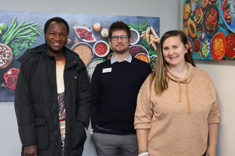 Student workers and Staff gathered in the new food pantry